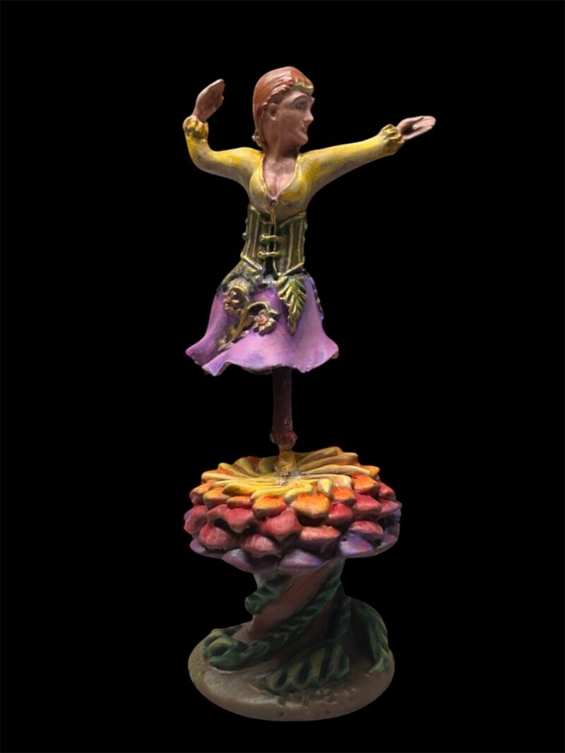 Sculpture of a dancer on a colorful flower